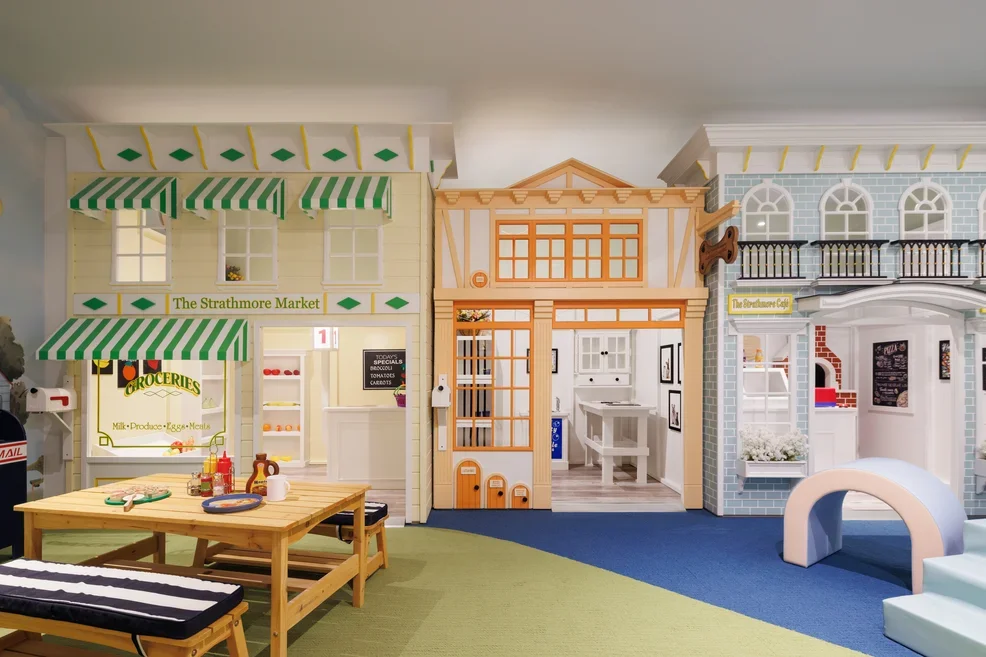 Kids room with light colors and play shops